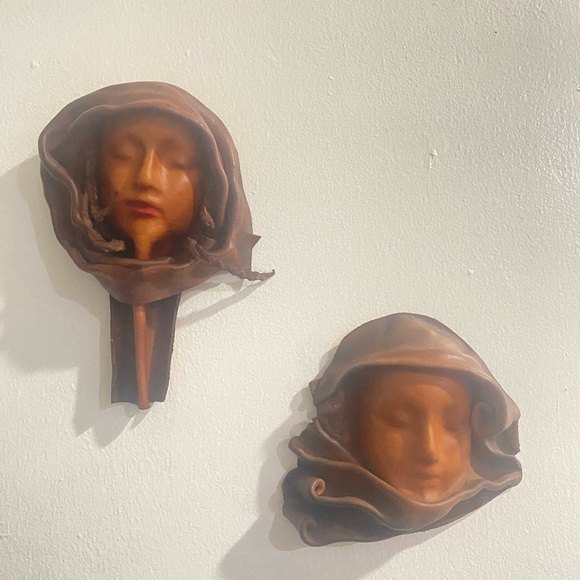 Two beautiful leather wall decor face sculptures signed Art Cuero 2003 Colombia